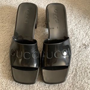 Gucci jelly slides.